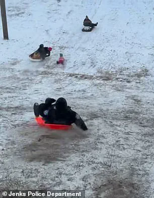 Oklahoma Police Officer Accidentally Hits Child with Sled During Snow Day; Video Goes Viral, No Injuries Reported