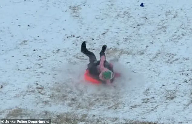 Oklahoma Police Officer Accidentally Hits Child with Sled During Snow Day; Video Goes Viral, No Injuries Reported