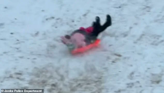 Oklahoma Police Officer Accidentally Hits Child with Sled During Snow Day; Video Goes Viral, No Injuries Reported