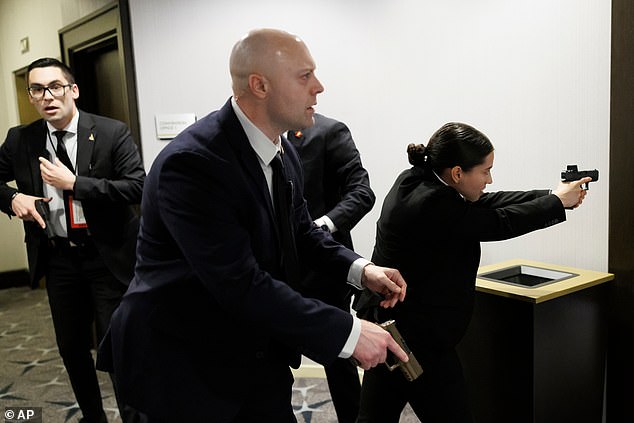 Gunfire erupts at Trump rally, forcing Secret Service evacuation of stage.