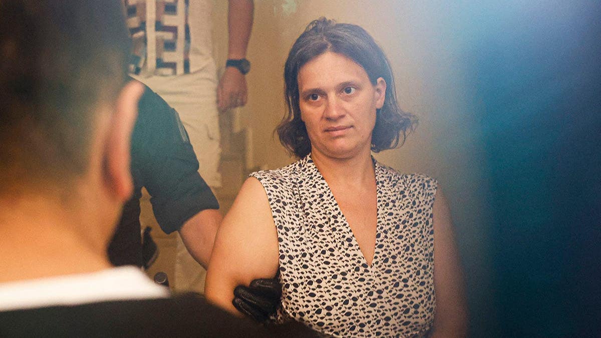 Mother arrested with ex-cop after abandoning sons in forest.