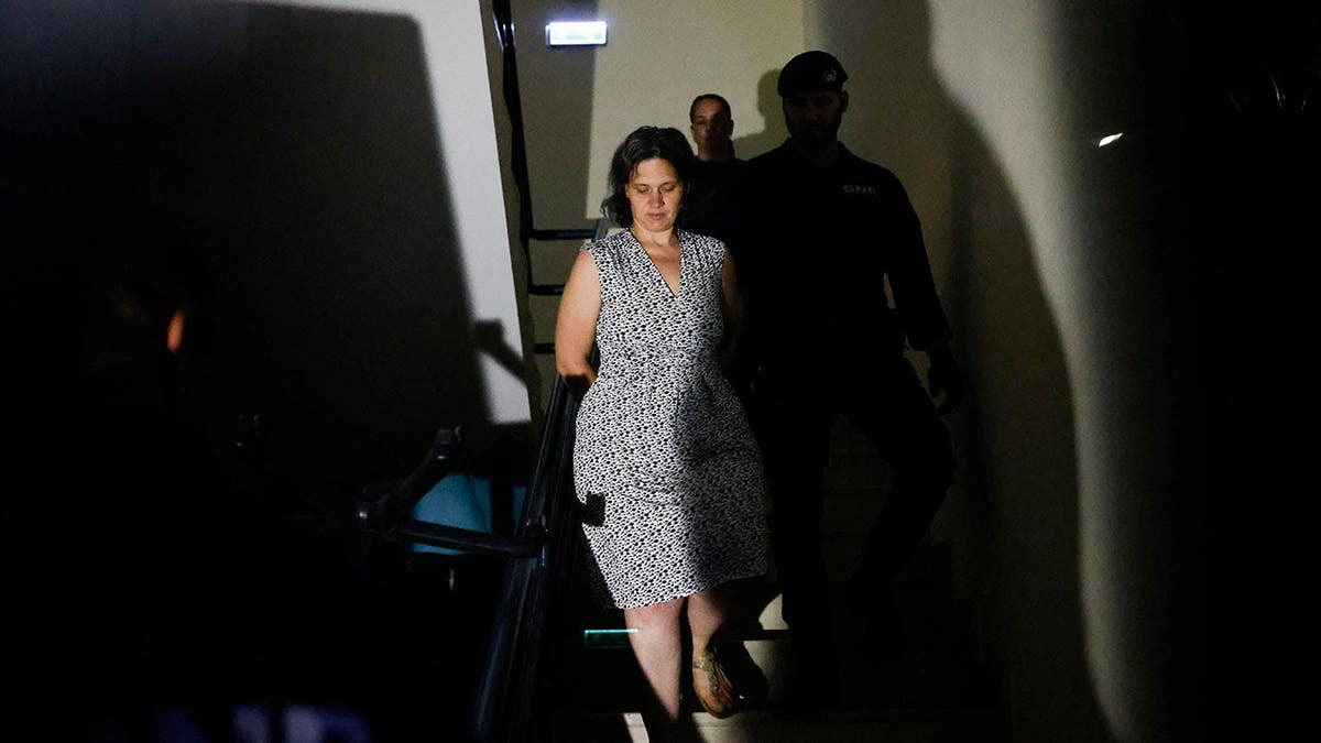 Mother arrested with ex-cop after abandoning sons in forest.