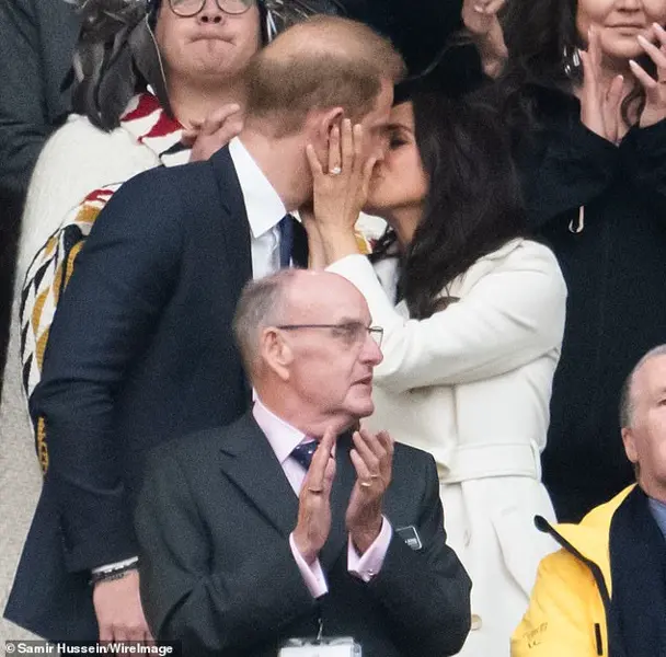 Harry and Meghan display public affection after Trump criticism