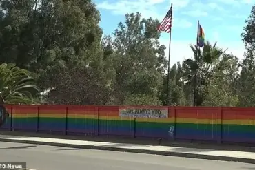 Lesbian woman discovers hateful teen group vandalizing pride fence