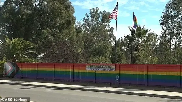 Lesbian woman discovers hateful teen group vandalizing pride fence