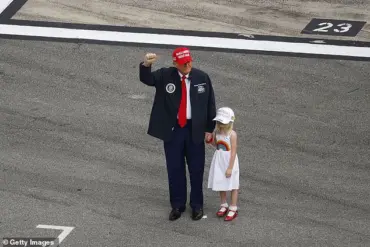 Trump's granddaughter waves at crowd from presidential limousine during Daytona 500