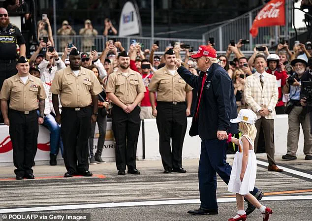 Trump's granddaughter waves at crowd from presidential limousine during Daytona 500