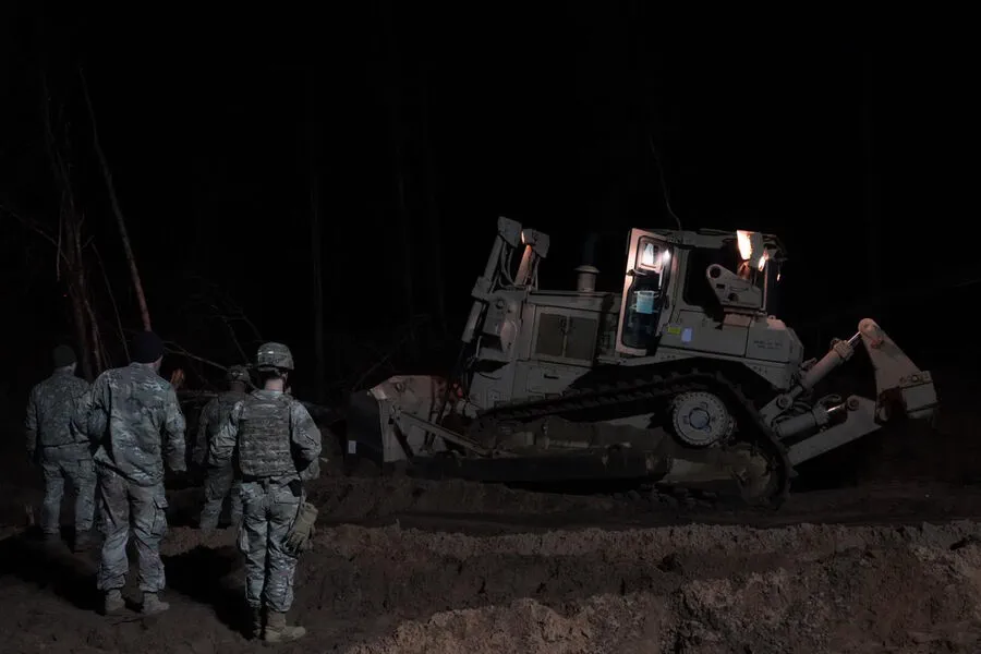 American Soldiers Engaged in Risky Rescue Mission for Stuck Armored Personnel Carrier Near Belarus Border